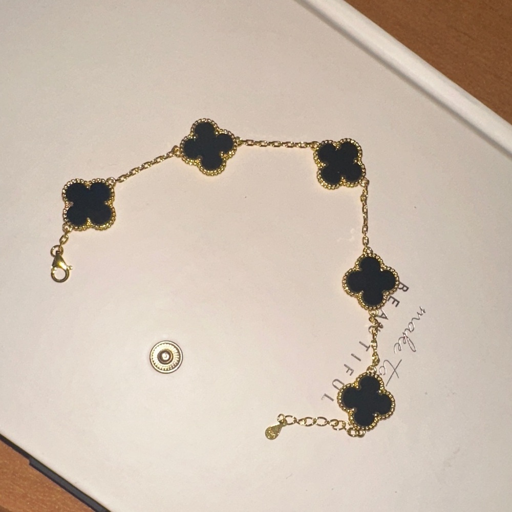 Elegant Black and Gold Clover Bracelet